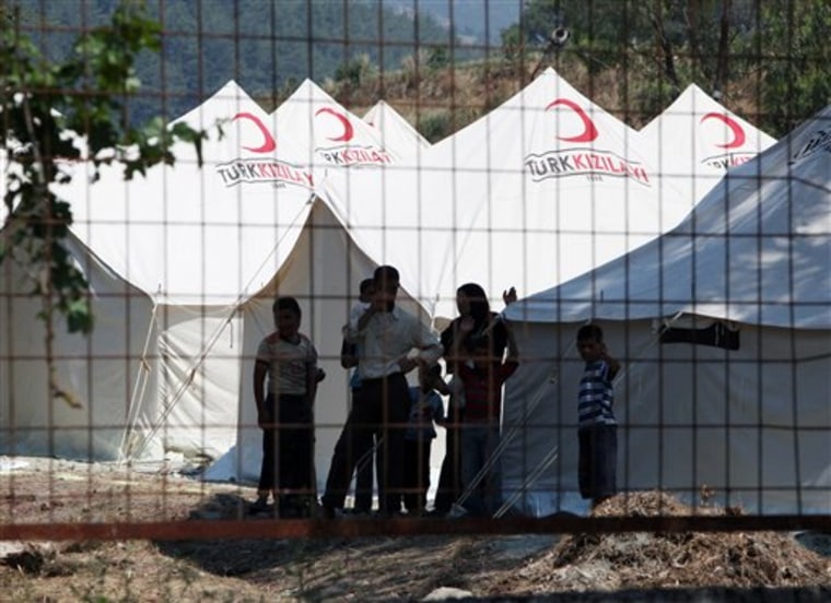 Syrians take refuge Thursday in a camp set up by the Turkish Red Crescent in Turkish town of Yayladagi in Hatay province, Turkey.
